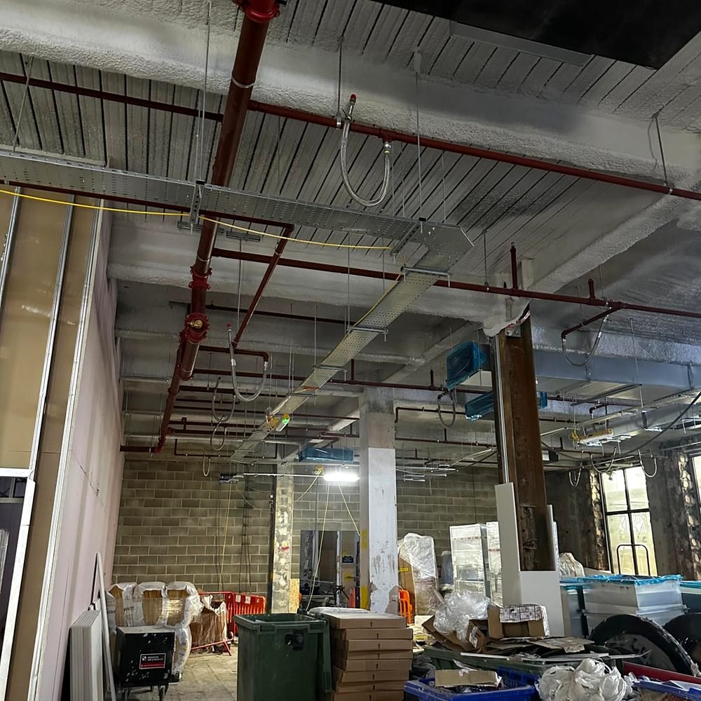 Sprinkler pipework going in during a fit-out, typical of fire sprinkler installation in London