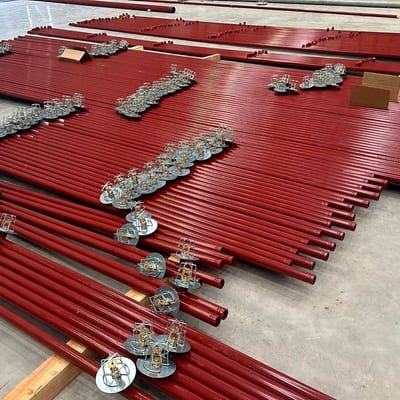 Prefabricated sprinkler pipework and brackets laid out ready to install
